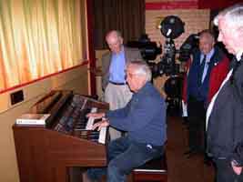 Laurie at the organ with Don, John and Neil. Historical projector behind.