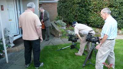  08. Neil, Laurie and Brian filming Peter as council official