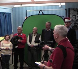 Club members sing a festive song with words by Karen