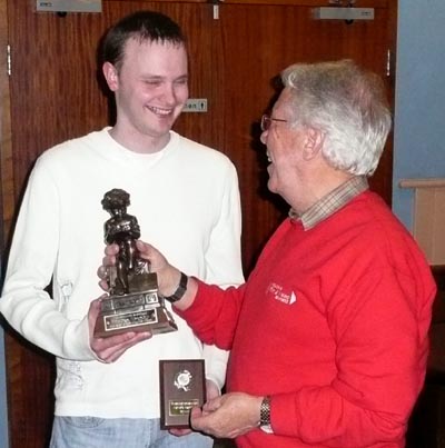 Andy receiving the Fiction trophy and shield