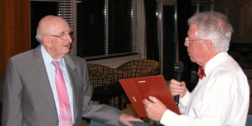  05. Bernard receiving his plaque from Laurie for 53 years in the club