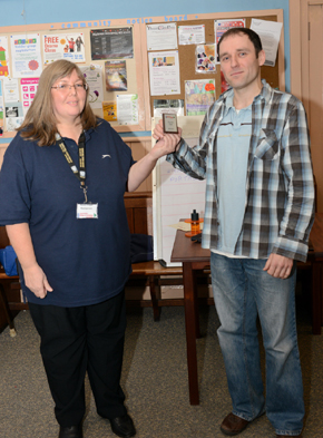 Karen presenting Tomasz with the mini shield