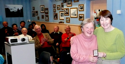 Audrey receiving the fiction trophy from Anne