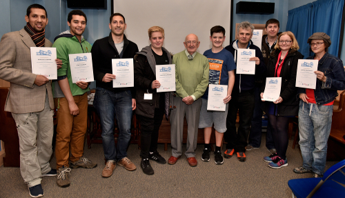 Bernard among the students with their certificates.