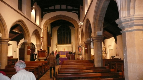 Members study the inside of the church