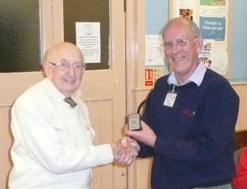 Bernard presenting Brian with the mini shield