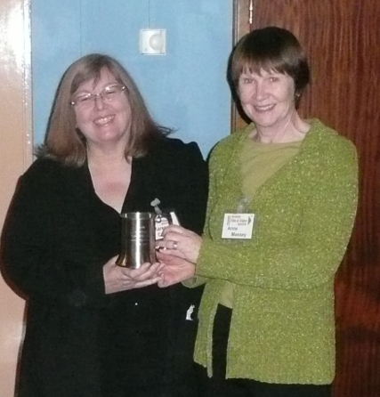 Karen receives a tankard from Anne for her time as Chair