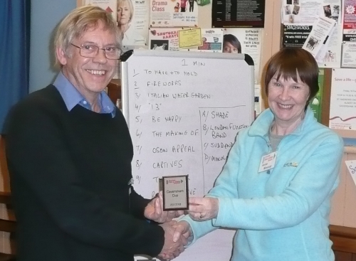 JIm recieves the Caversham mini shield from Anne