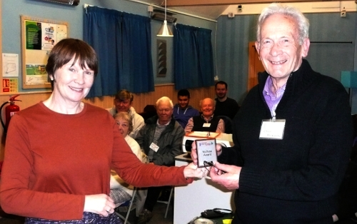 Anne presents Chris with YouTube mini shield