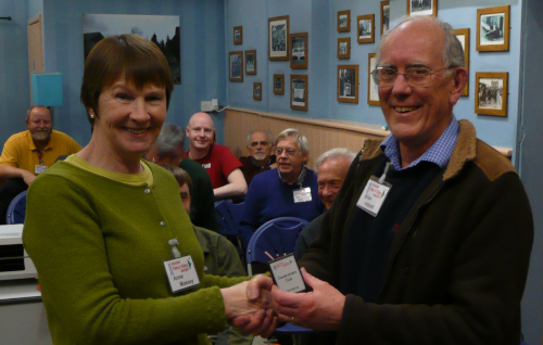 Anne presents Brian with the mini shield