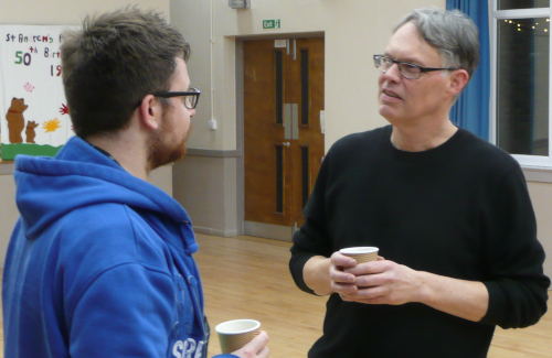 Alan talking to Leon in the tea break